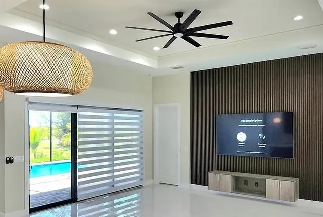 a view of hallway with a large window and a chandelier