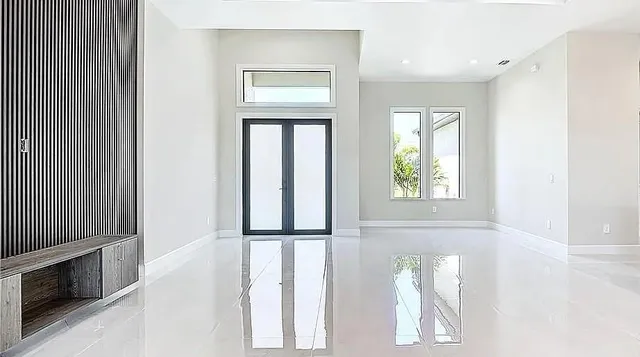 a view of an entryway with wooden floor