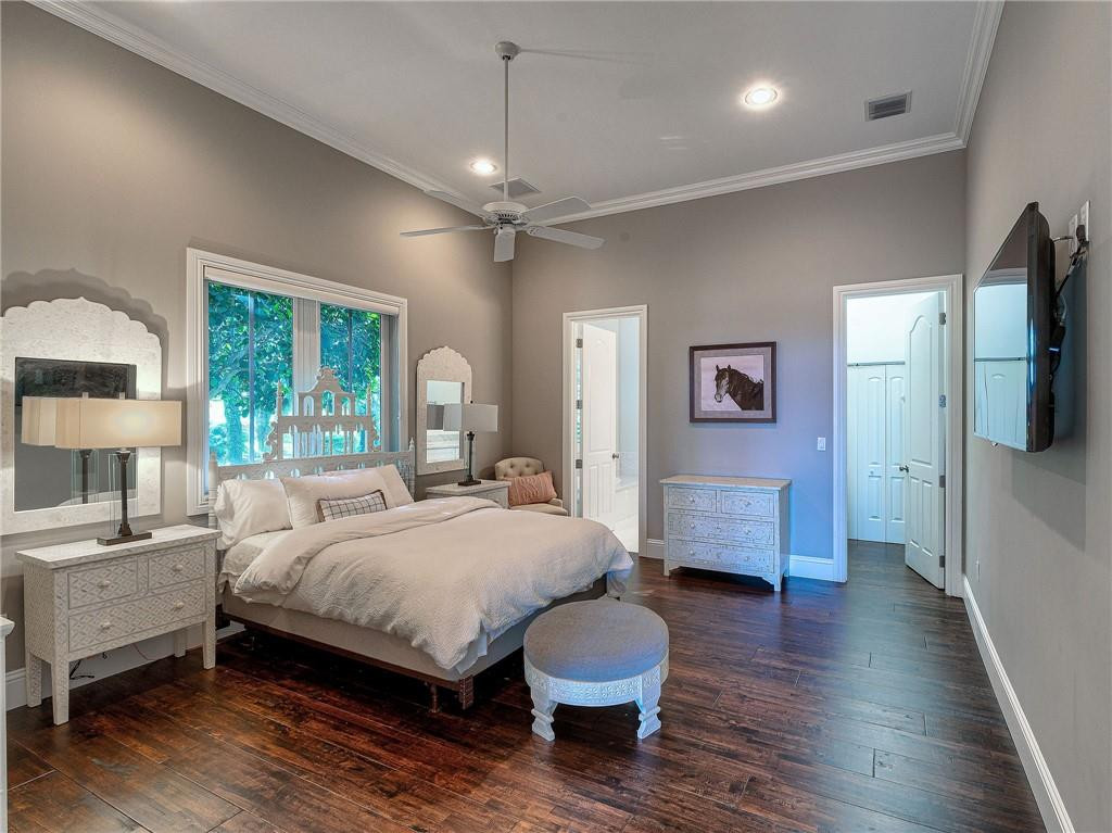 2920 Hunter Road Weston, FL 33331 - Photo 17 of 51 a bedroom with a bed and wooden floor