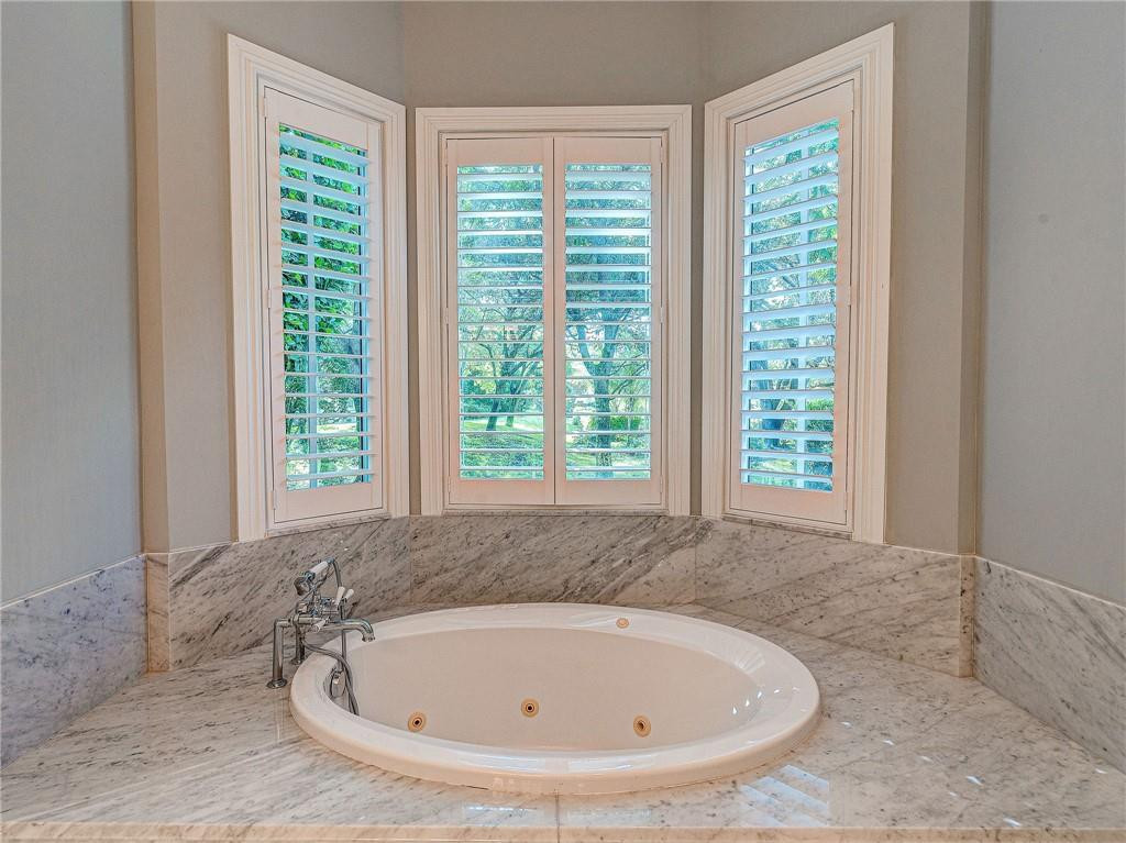 2920 Hunter Road Weston, FL 33331 - Photo 19 of 51 a white bath tub sitting in a bathroom next to a window