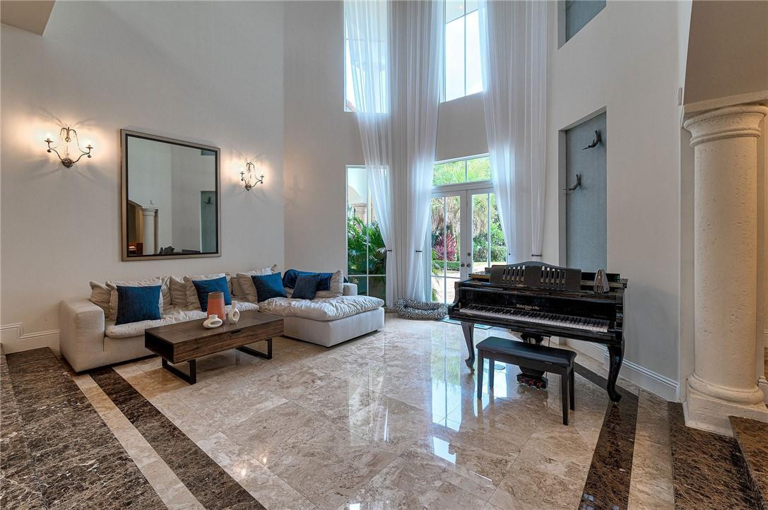 2920 Hunter Road Weston, FL 33331 - Photo 25 of 51 a living room with furniture and a piano