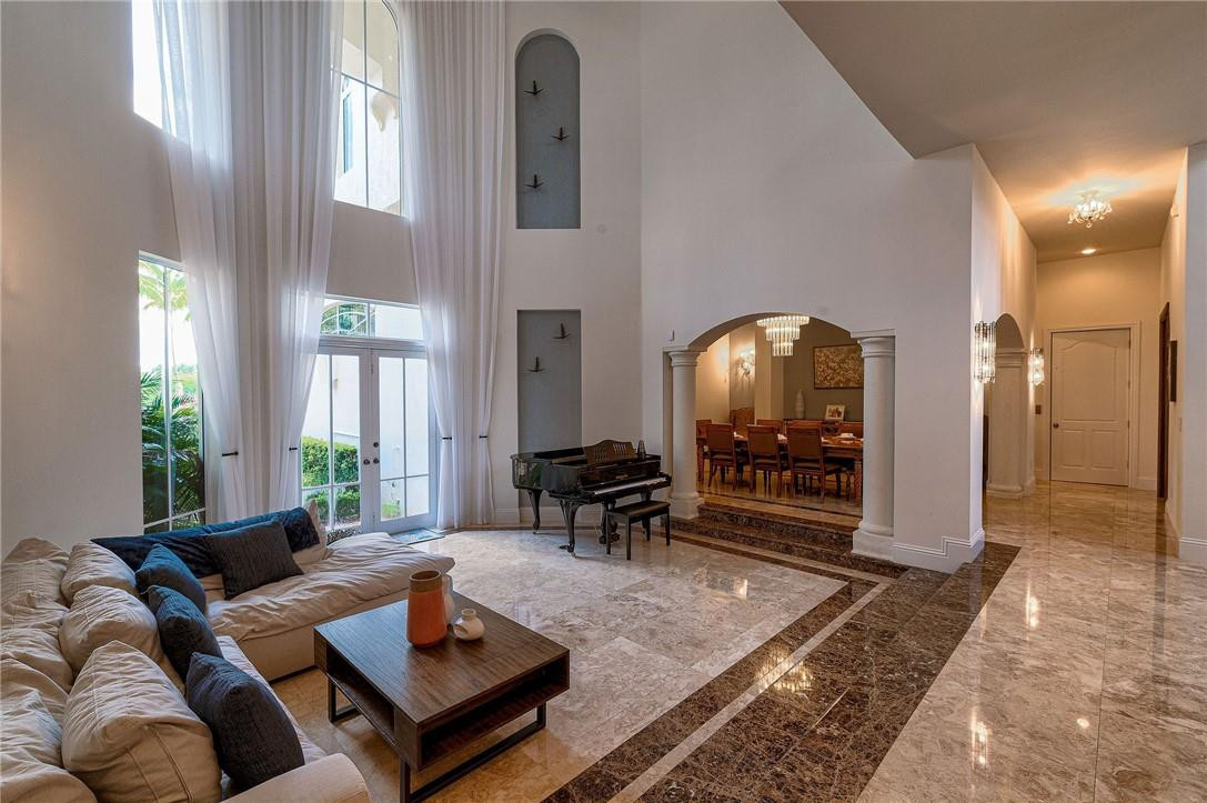 2920 Hunter Road Weston, FL 33331 - Photo 26 of 51 a living room with furniture and a fireplace