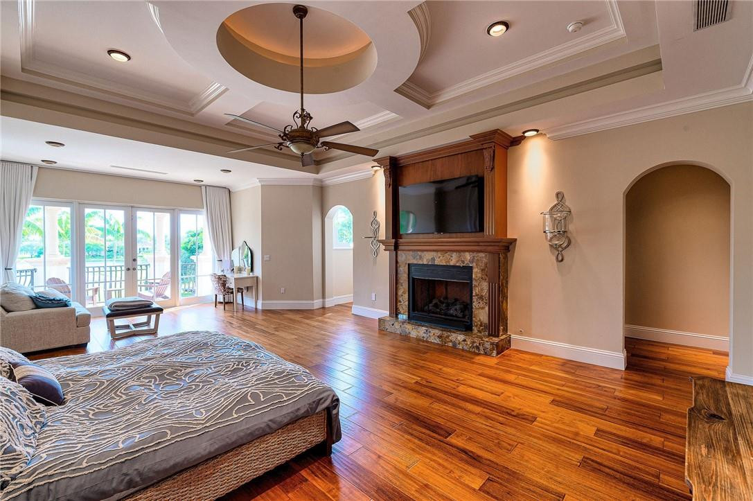 2920 Hunter Road Weston, FL 33331 - Photo 28 of 51 a living room with furniture a fireplace and a flat screen tv