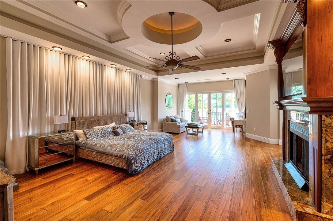 2920 Hunter Road Weston, FL 33331 - Photo 29 of 51 a spacious bedroom with two beds and a chandelier