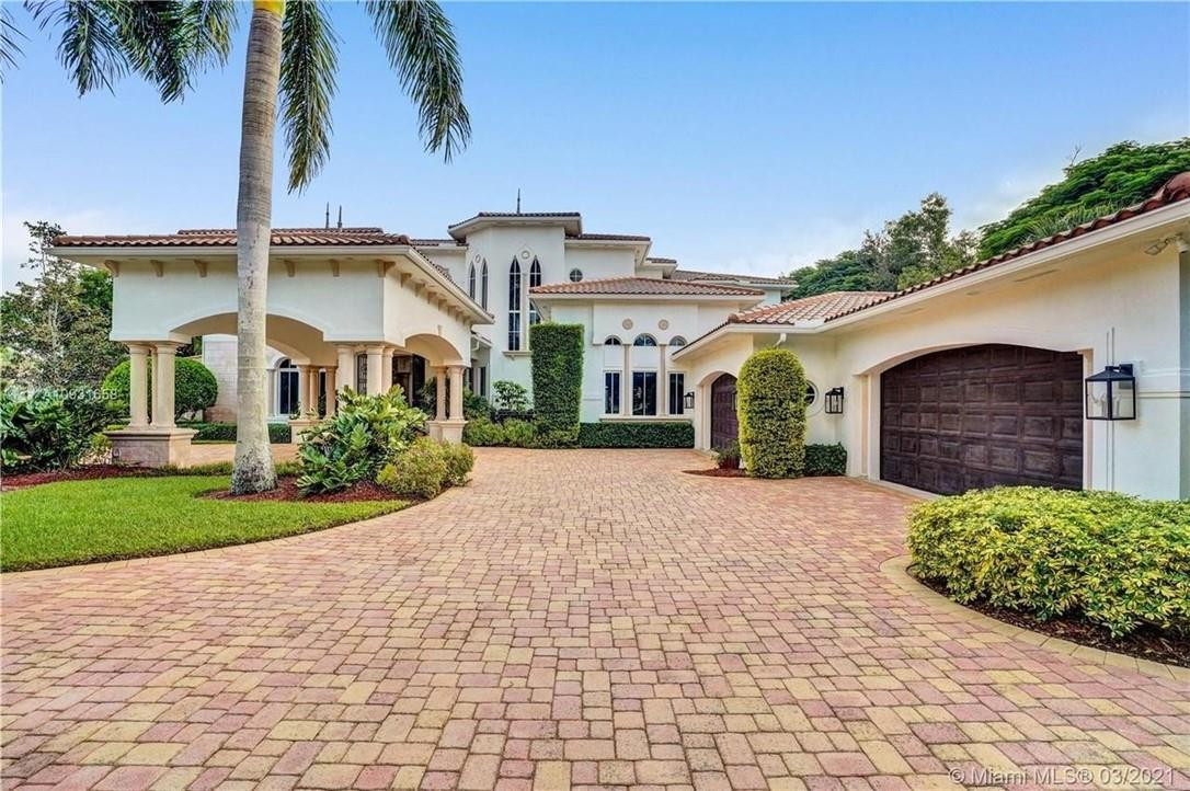 2920 Hunter Road Weston, FL 33331 - Photo 3 of 51 a front view of a house with a yard and garage