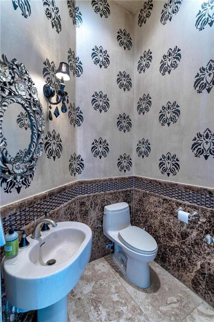 2920 Hunter Road Weston, FL 33331 - Photo 33 of 51 a bathroom with a toilet and sink