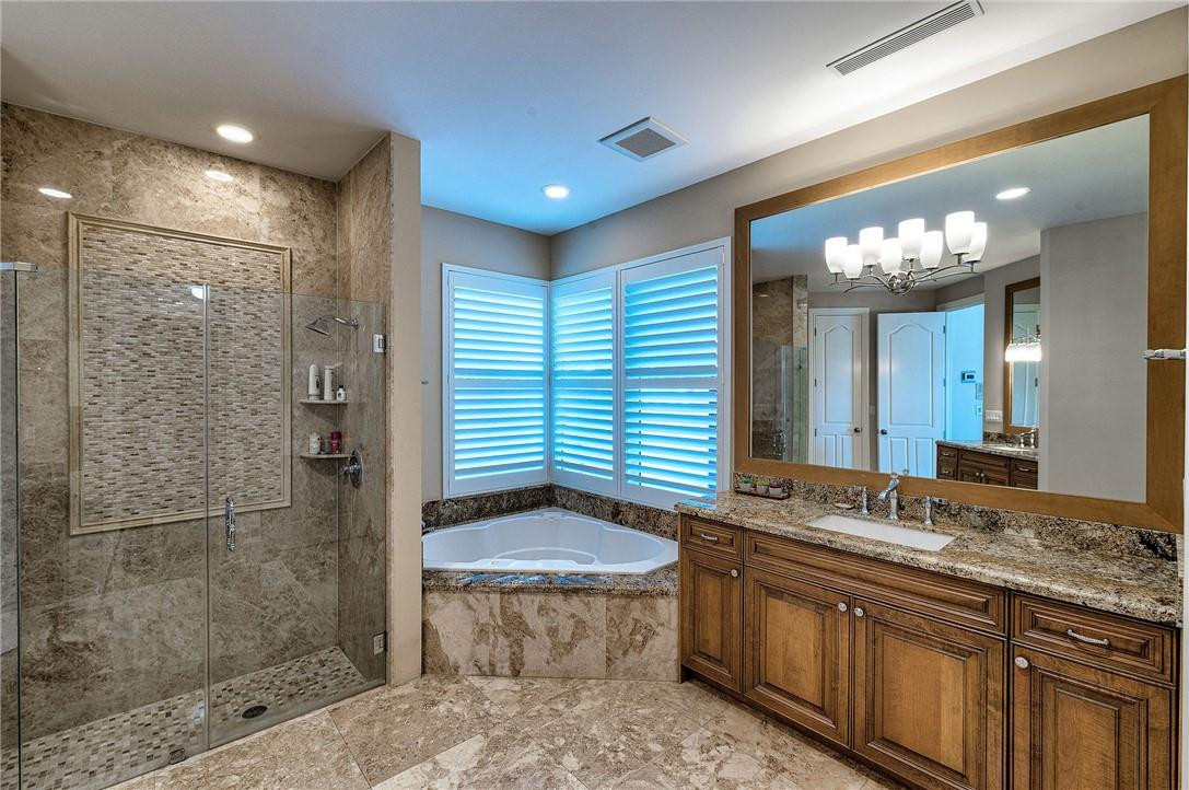 2920 Hunter Road Weston, FL 33331 - Photo 36 of 51 a bathroom with a granite countertop sink a toilet a mirror and shower