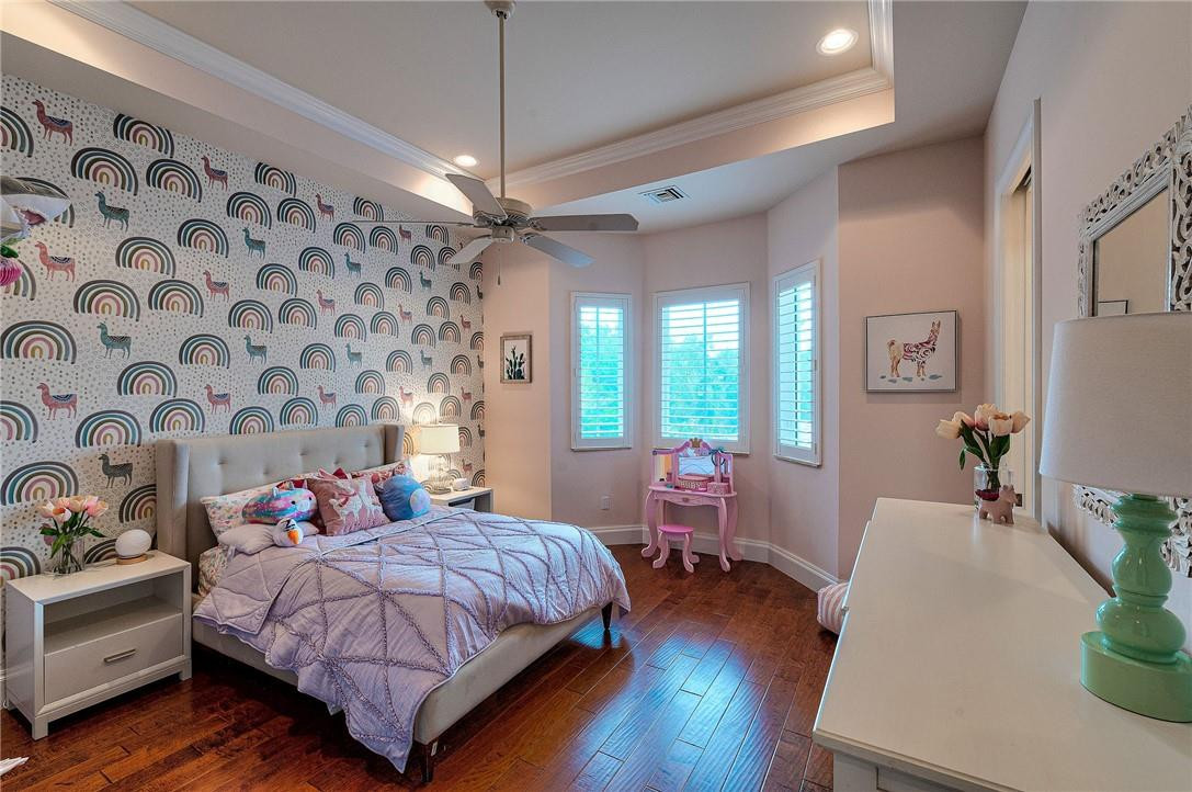 2920 Hunter Road Weston, FL 33331 - Photo 37 of 51 a bedroom with a large bed and wooden floor