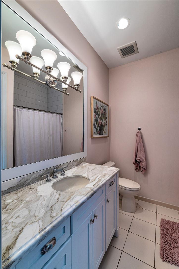 2920 Hunter Road Weston, FL 33331 - Photo 40 of 51 a bathroom with a granite countertop sink a toilet and a mirror