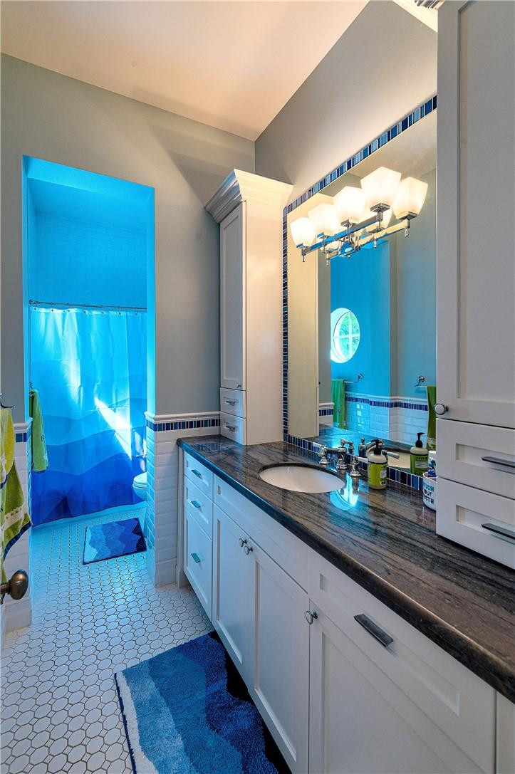 2920 Hunter Road Weston, FL 33331 - Photo 41 of 51 a bathroom with a double vanity sink and a mirror