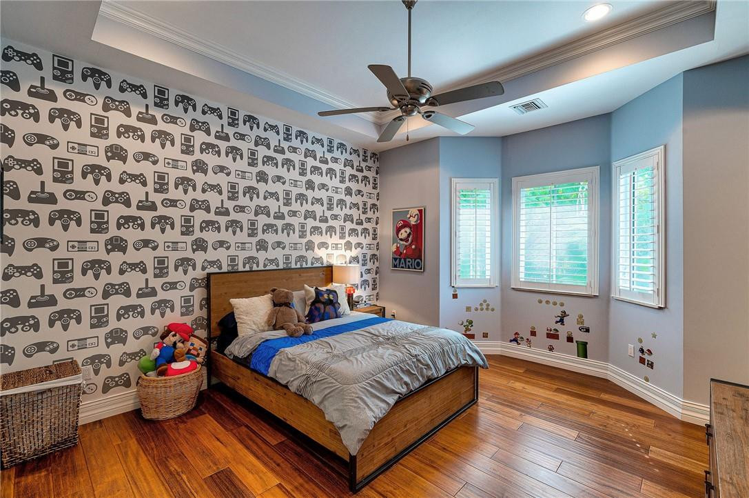 2920 Hunter Road Weston, FL 33331 - Photo 42 of 51 a bedroom with a bed and wooden floor