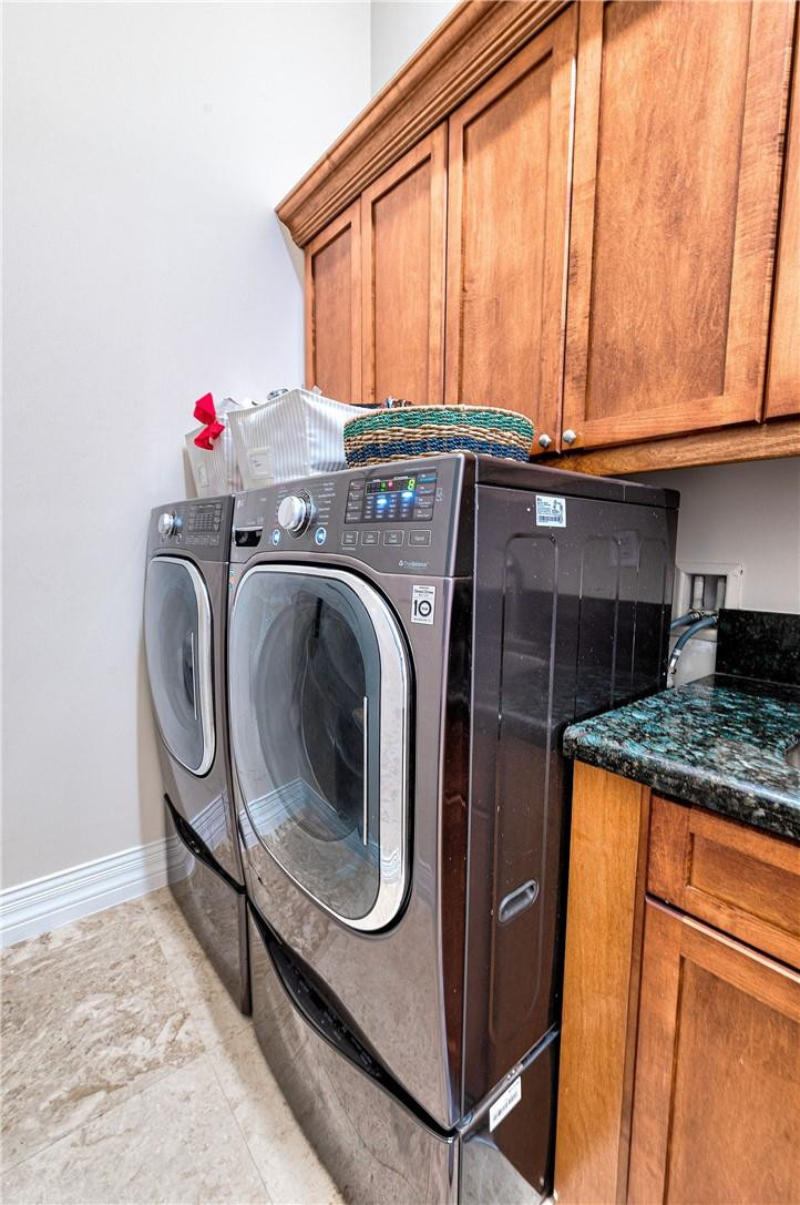 2920 Hunter Road Weston, FL 33331 - Photo 44 of 51 a utility room with dryer and washer