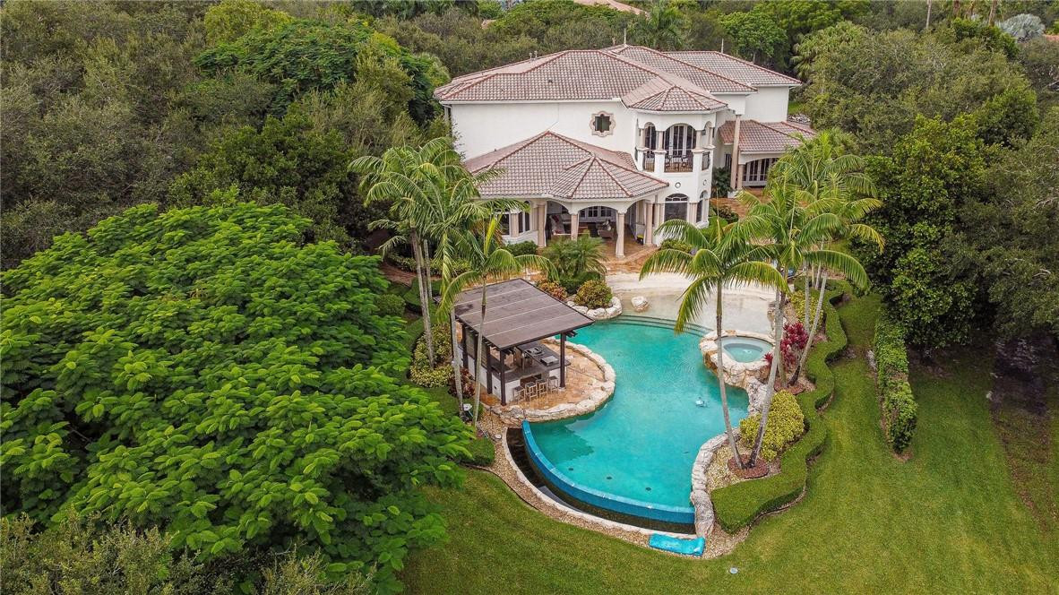 2920 Hunter Road Weston, FL 33331 - Photo 51 of 51 an aerial view of a house with swimming pool and garden