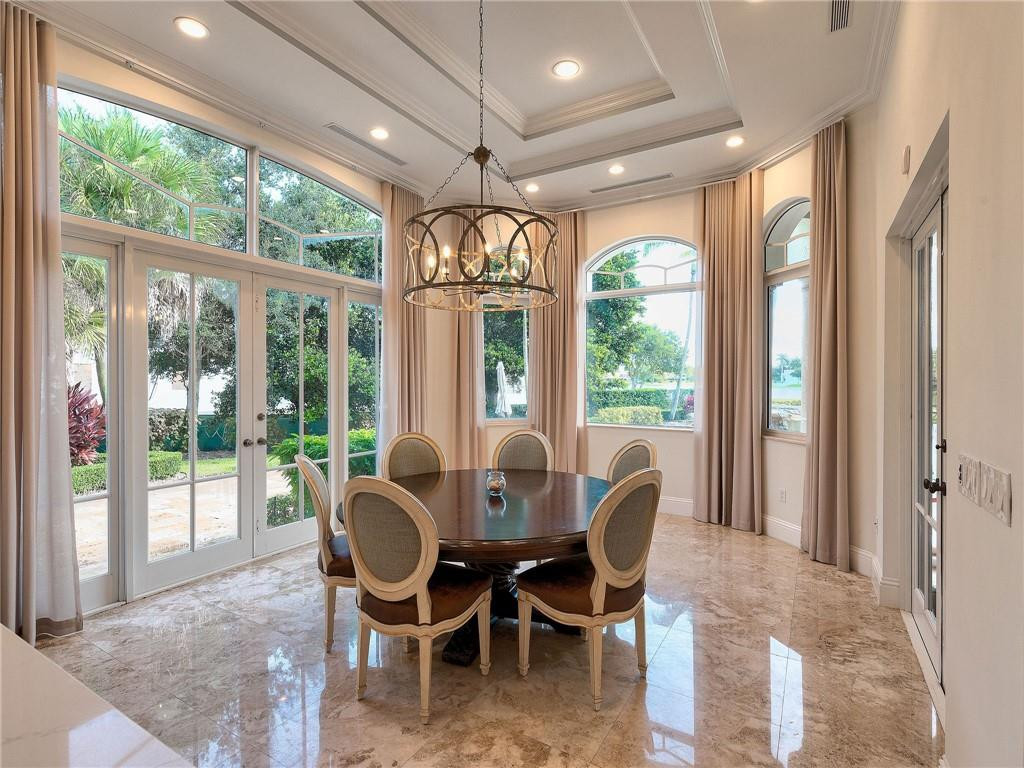 2920 Hunter Road Weston, FL 33331 - Photo 7 of 51 a view of a dining room with furniture large windows and wooden floor