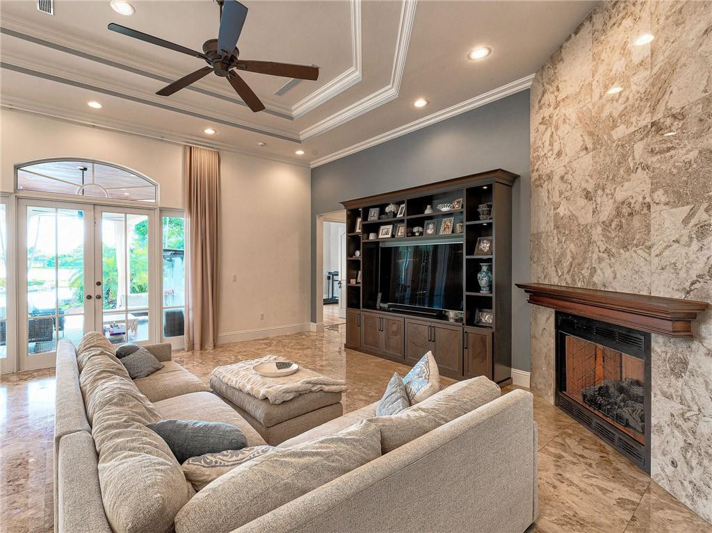 2920 Hunter Road Weston, FL 33331 - Photo 8 of 51 a living room with furniture and a fireplace