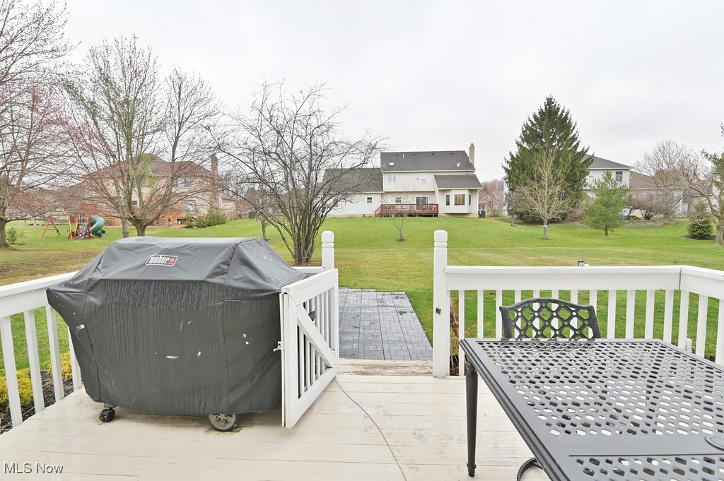 482 Longspur Road Highland Heights, OH 44143 - Photo 46 of 47 Wooden terrace featuring a yard, outdoor dining area, and a grill