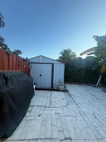 a view of a backyard of the house