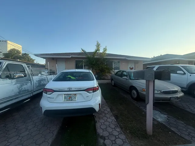 a car parked in front of a house