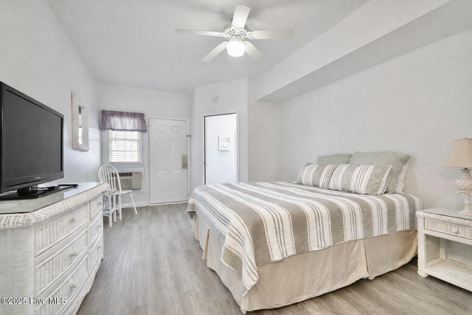 165 Royal Poste Road, Unit 2911 Sunset Beach, NC 28468 - Photo 12 of 24 Bright guest bedroom with neutral finishes and flexible layout for guests or home office; includes a separate entry door to the unit.