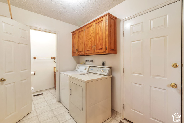 386 North 210 East Mapleton, UT 84664 - Photo 7 of 30 Functional laundry area featuring upper wood cabinetry and tile flooring
