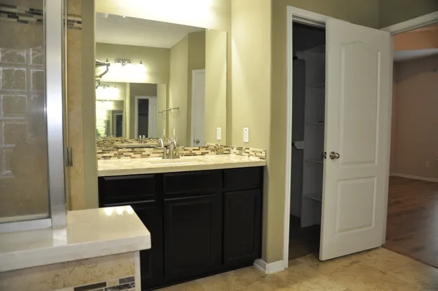 a bathroom with a sink and a mirror