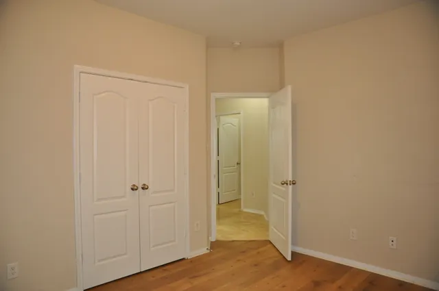 a view of a bathroom with wooden floor