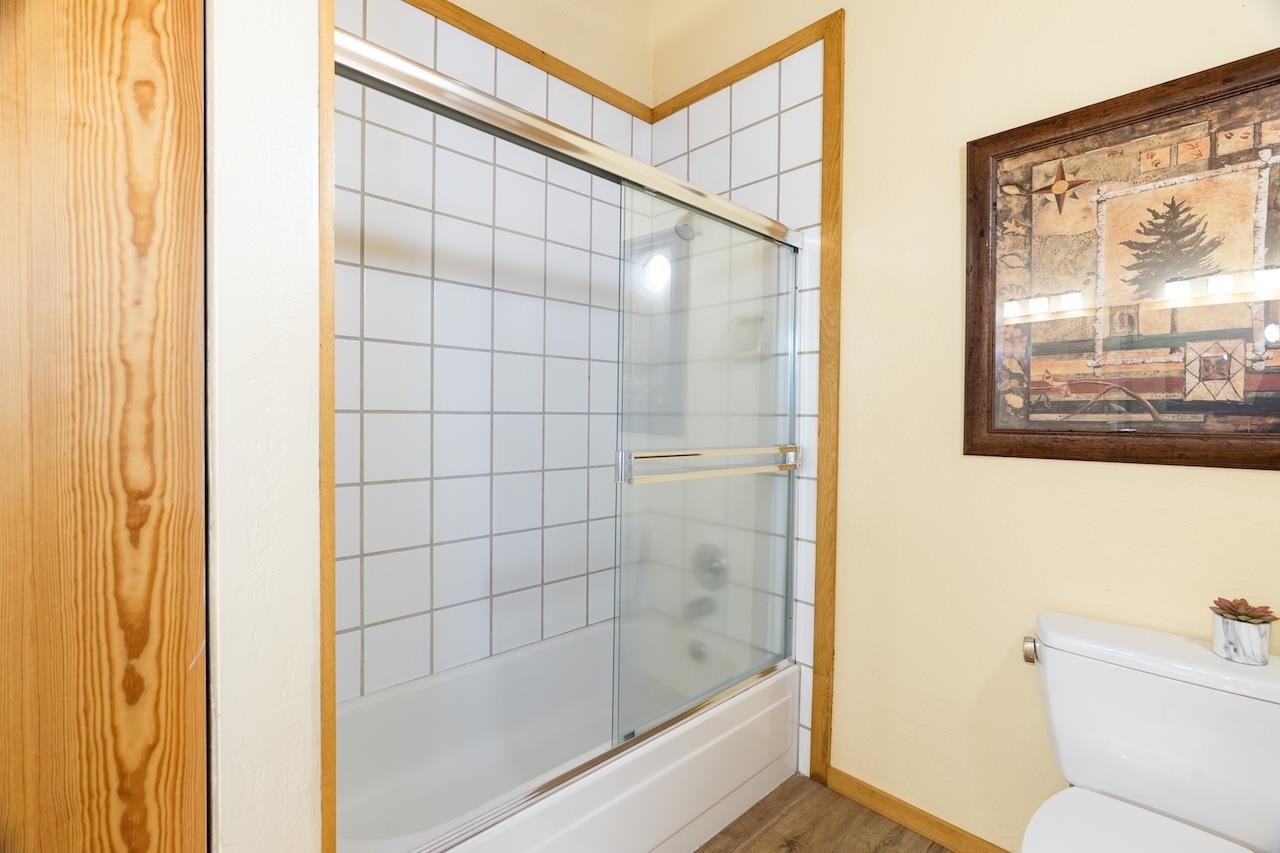 11940 Sitzmark Way Truckee, CA 96161 - Photo 20 of 28 a bathroom with a shower and bathtub