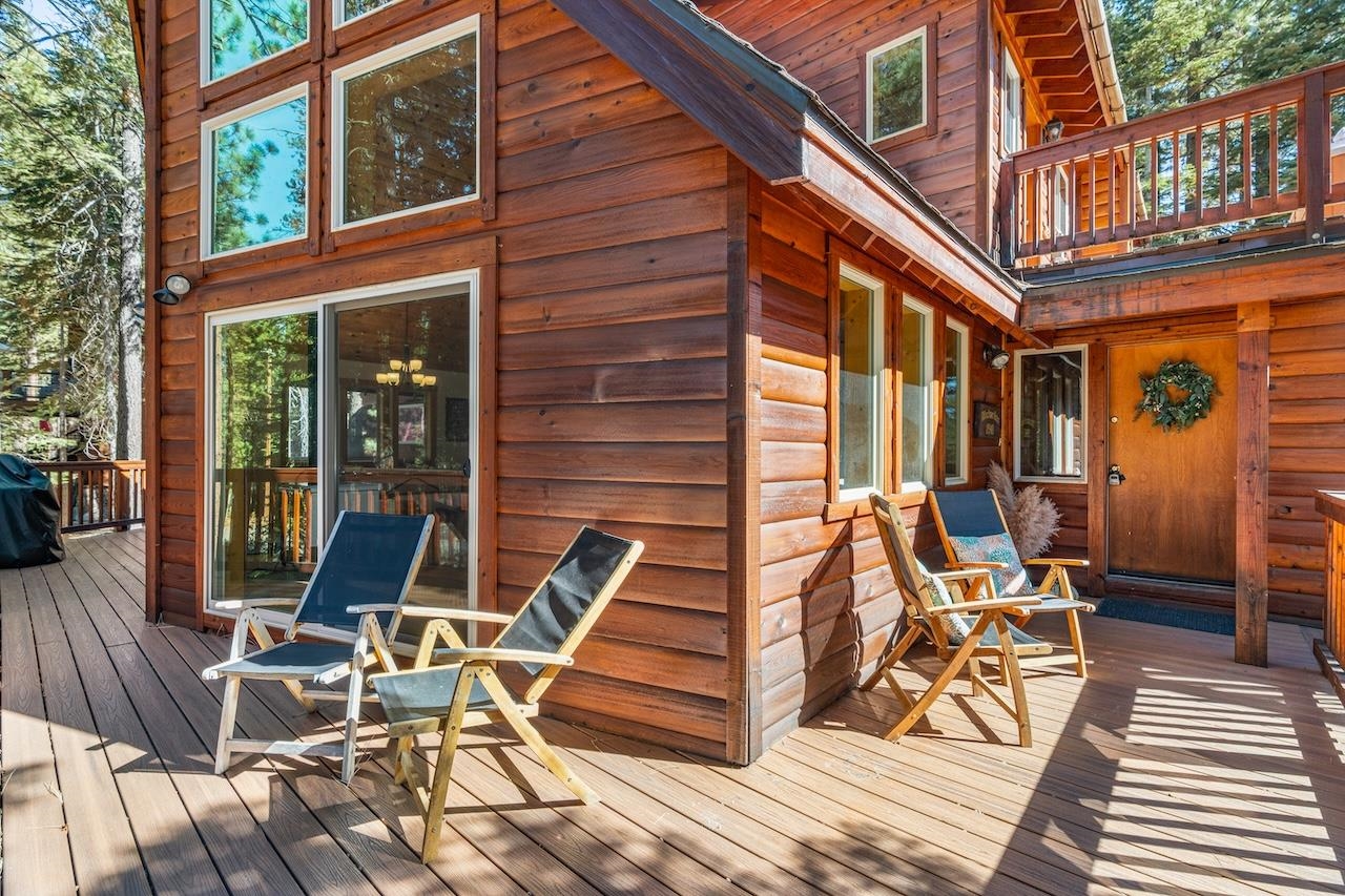 11940 Sitzmark Way Truckee, CA 96161 - Photo 22 of 28 a view of a patio with table and chairs wooden floor and fence
