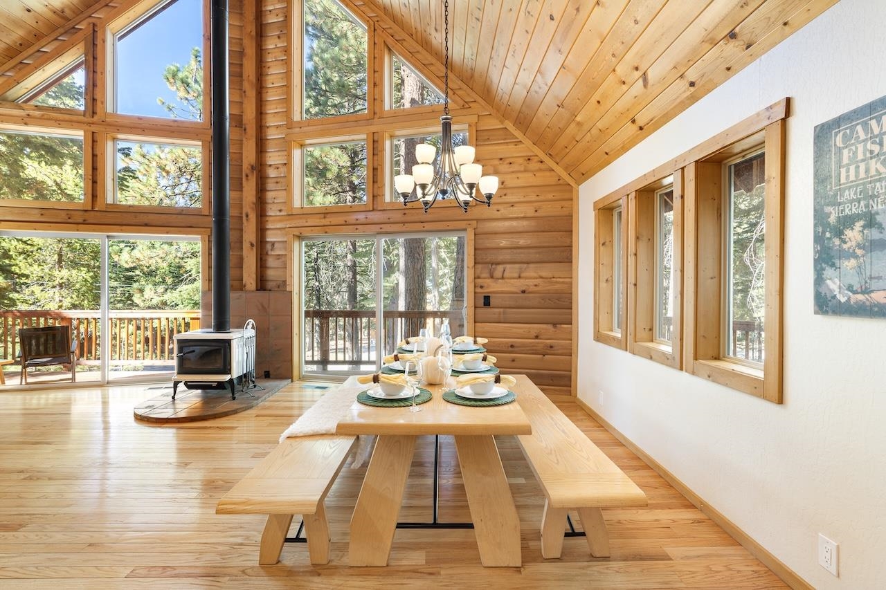 11940 Sitzmark Way Truckee, CA 96161 - Photo 8 of 28 a dining room with wooden floor and large windows