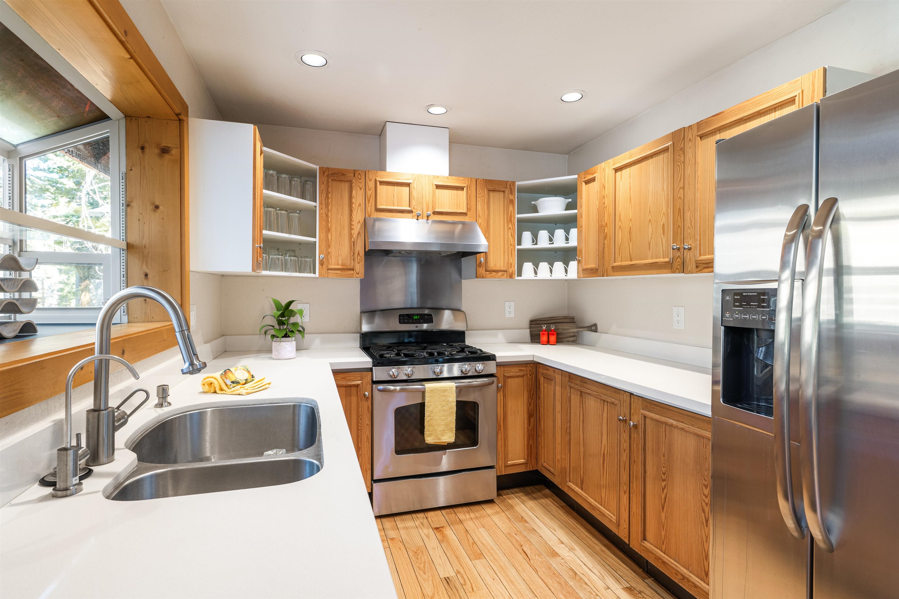 11940 Sitzmark Way Truckee, CA 96161 - Photo 9 of 28 a kitchen with a sink stove and refrigerator