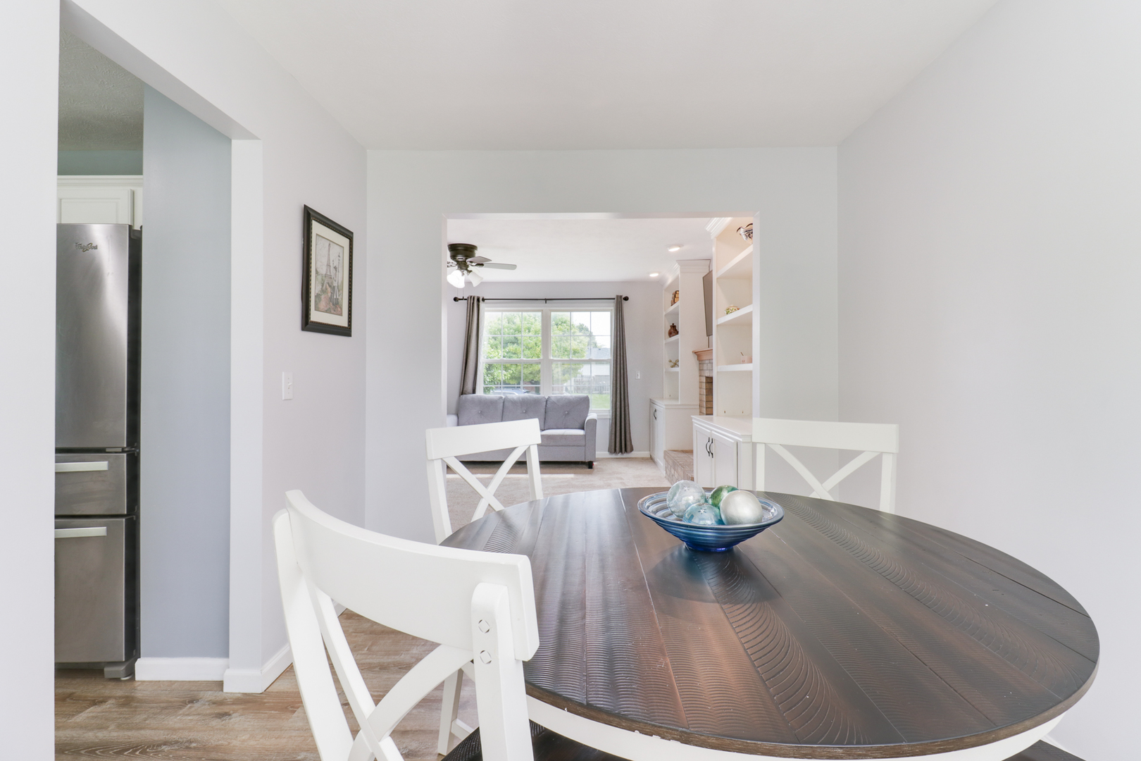 1505 Torrey Pines Road Normal, IL 61761 - Photo 8 of 38 a view of a dining room with furniture window and wooden floor