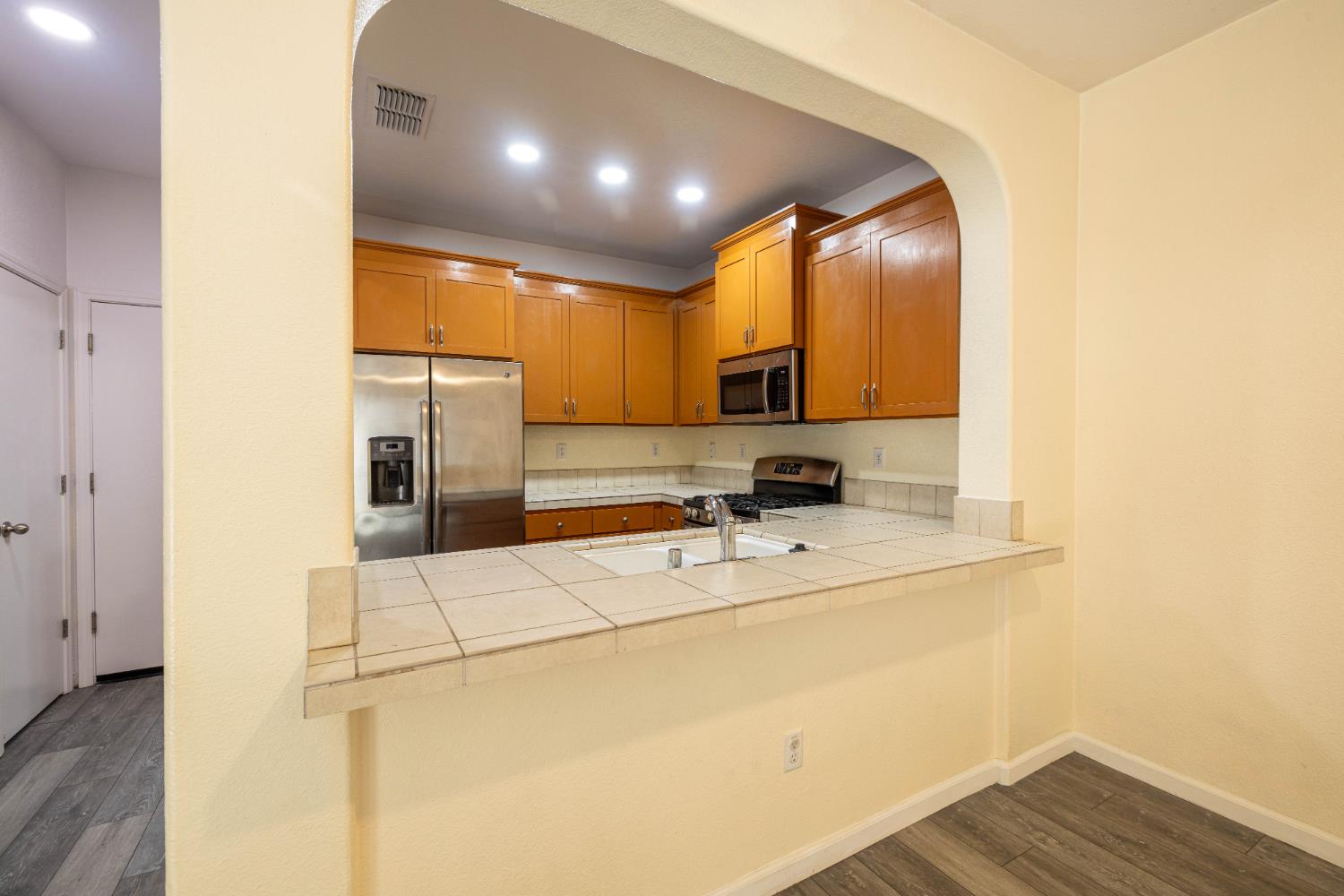 3122 Lea Sterling Way Rancho Cordova, CA 95670 - Photo 6 of 31 a kitchen with a sink appliances and cabinets