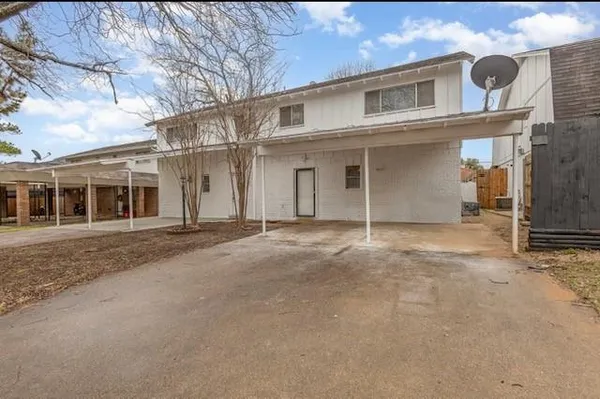 front view of a house with a street