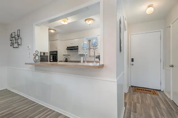 a kitchen with stainless steel appliances a refrigerator and microwave