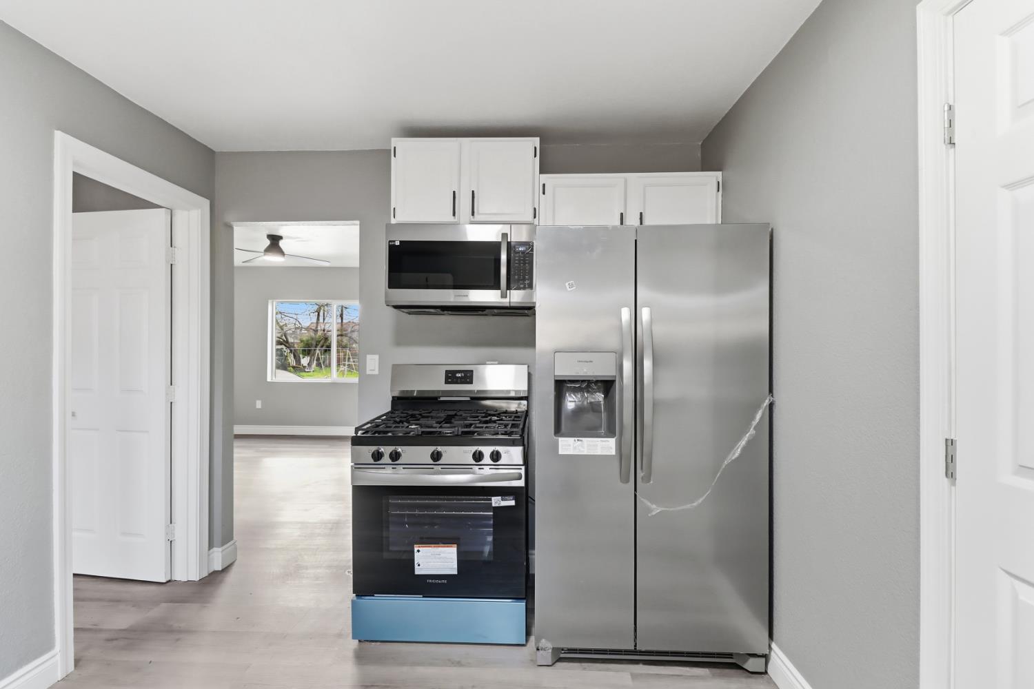 1099 Grand Avenue Olivehurst, CA 95961 - Photo 12 of 38 a kitchen with stainless steel appliances a refrigerator a stove a sink and dishwasher