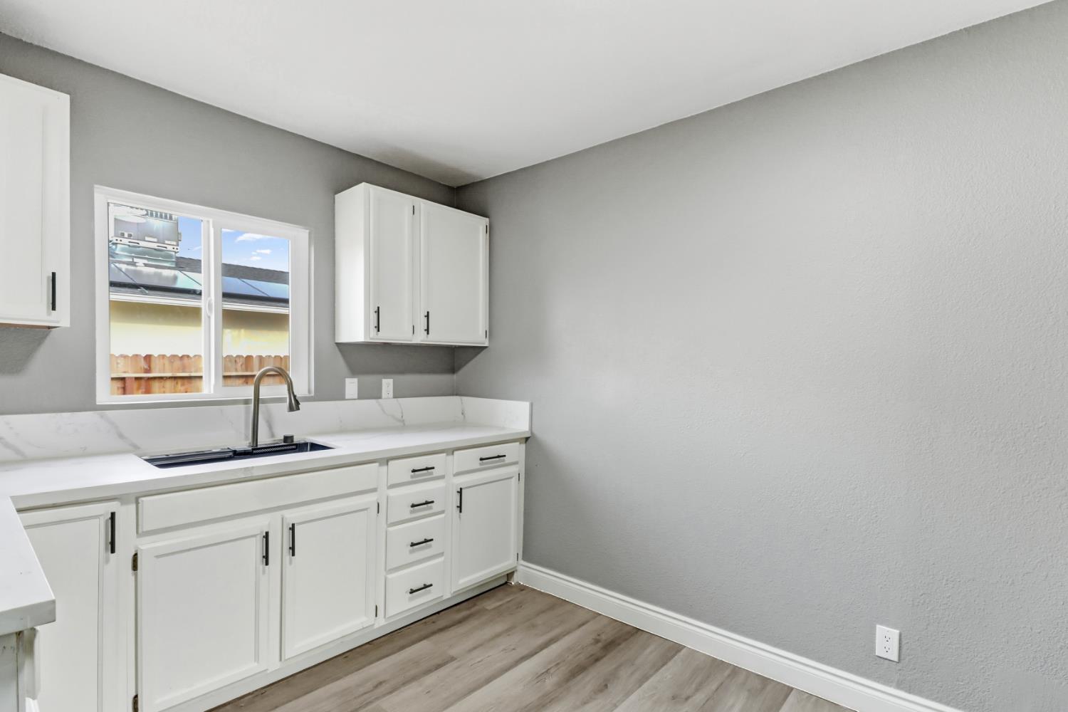 1099 Grand Avenue Olivehurst, CA 95961 - Photo 13 of 38 a kitchen with cabinets appliances and a window