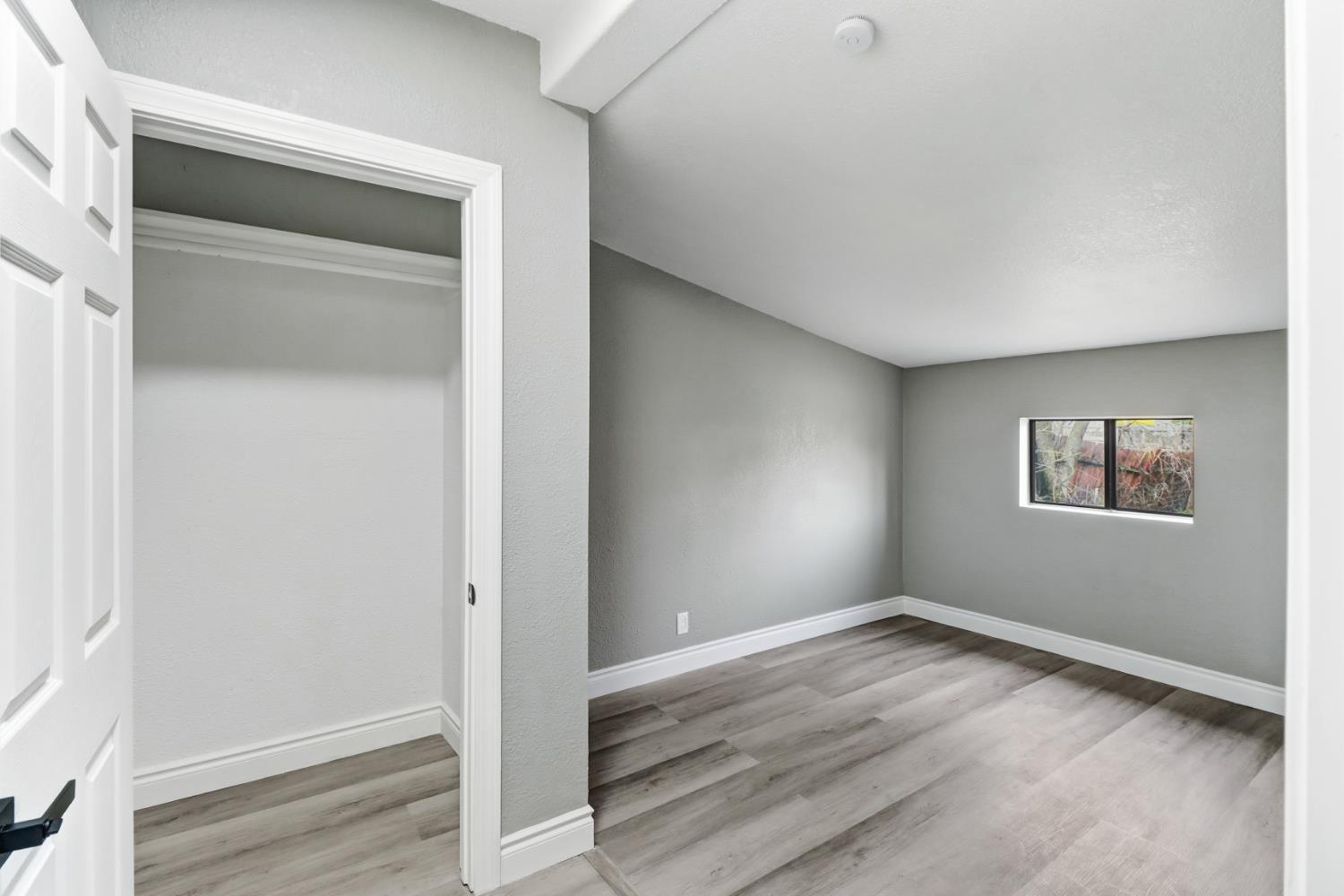 1099 Grand Avenue Olivehurst, CA 95961 - Photo 16 of 38 a view of empty room with wooden floor and closet