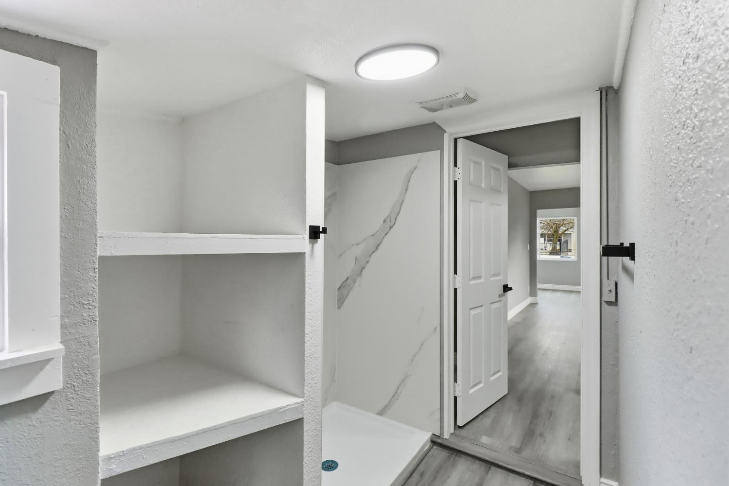 1099 Grand Avenue Olivehurst, CA 95961 - Photo 20 of 38 a bathroom with a shower and a glass door