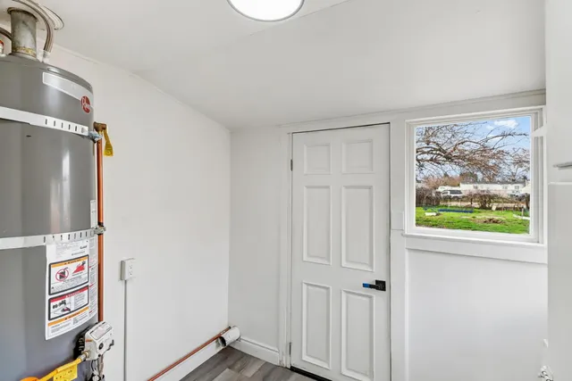 a view of an entryway with cabinets