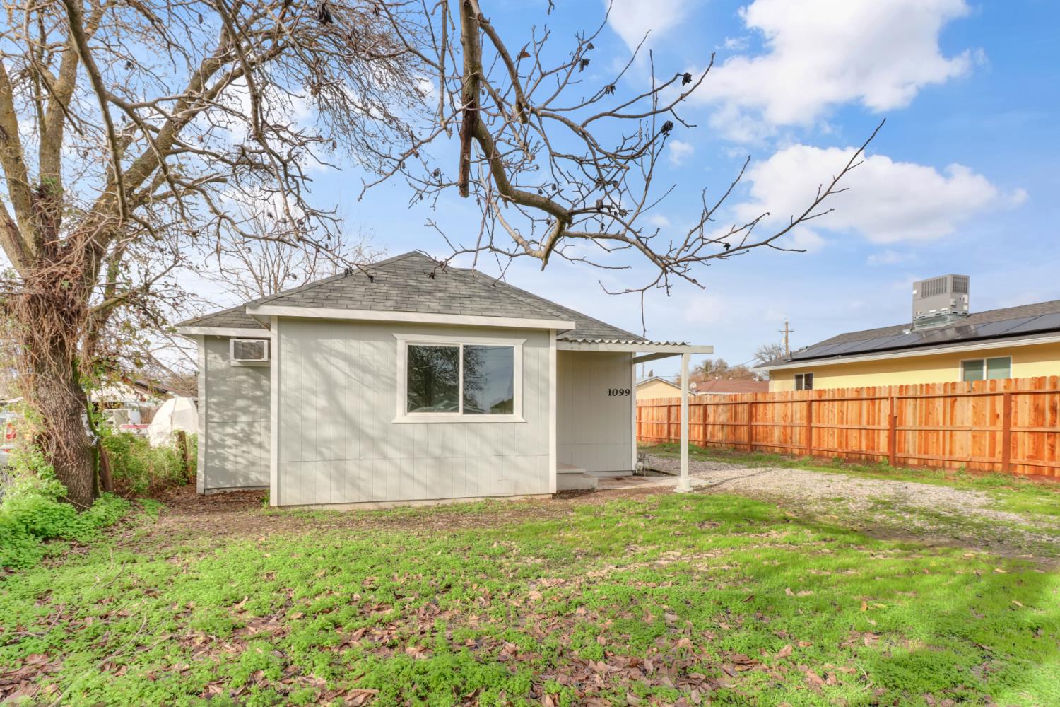 1099 Grand Avenue Olivehurst, CA 95961 - Photo 34 of 38 a front view of house with yard and trees