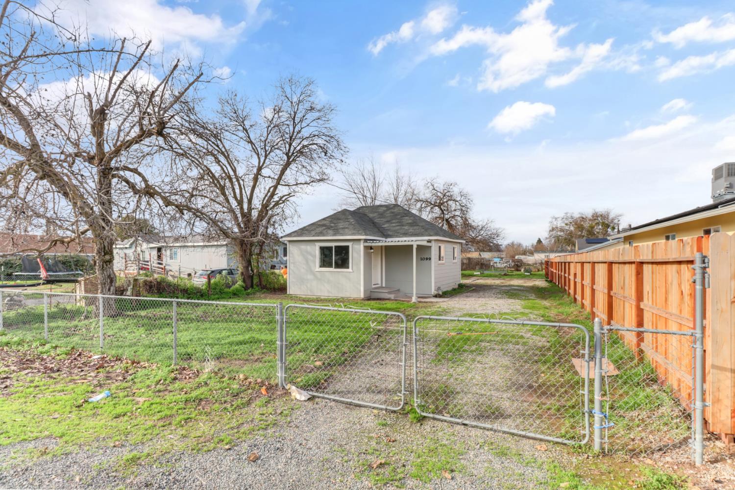 1099 Grand Avenue Olivehurst, CA 95961 - Photo 37 of 38 a view of a house with a yard