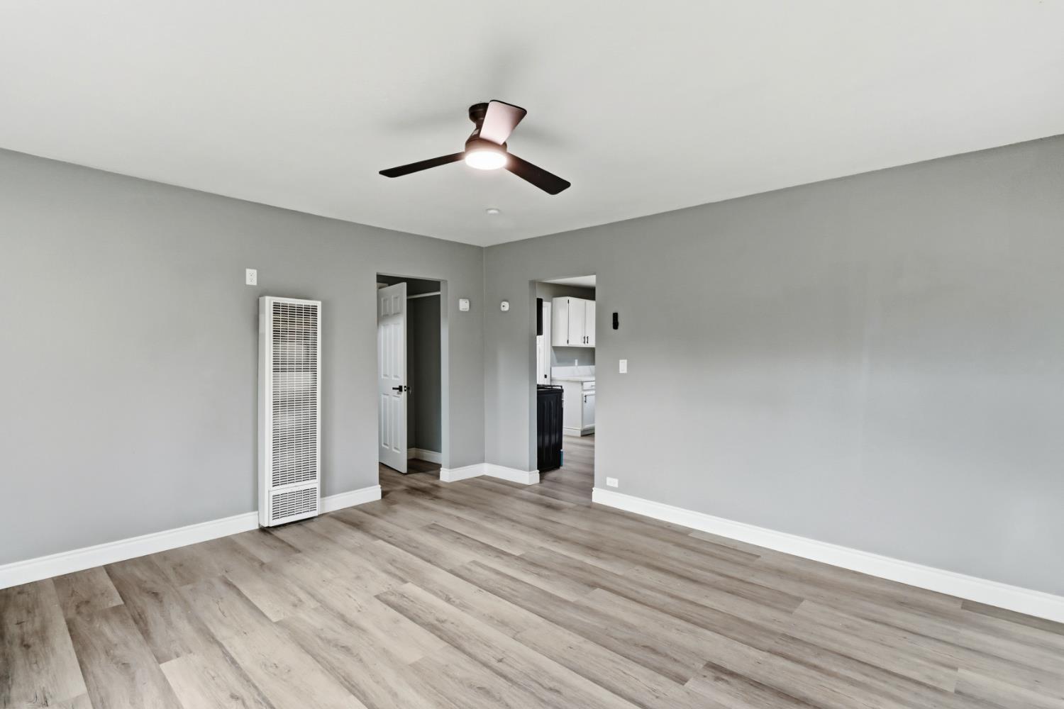 1099 Grand Avenue Olivehurst, CA 95961 - Photo 7 of 38 an empty room with wooden floor and windows