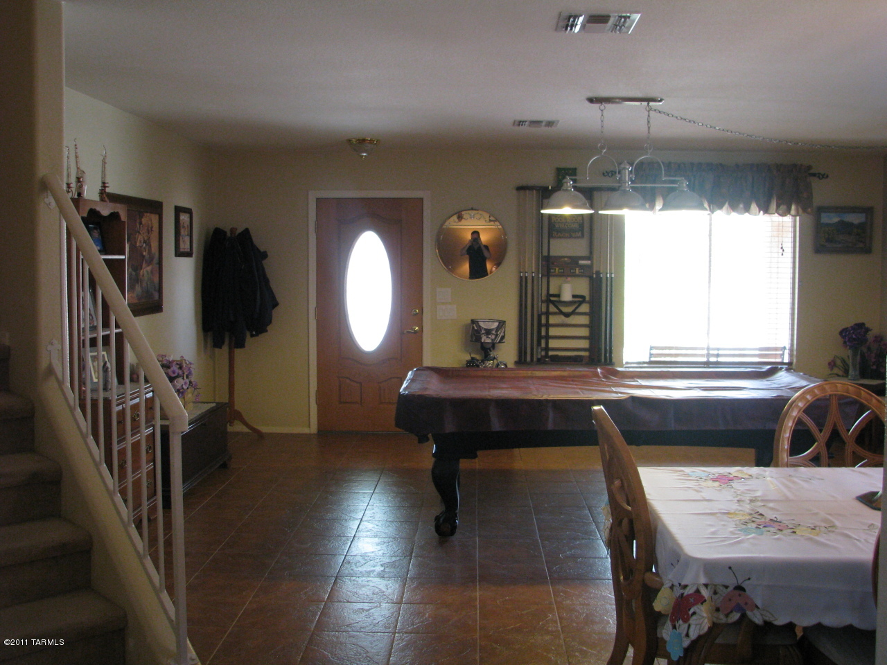 3728 East Mecate Road Tucson, AZ 85739 - Photo 2 of 9 a view of a livingroom with furniture window and wooden floor