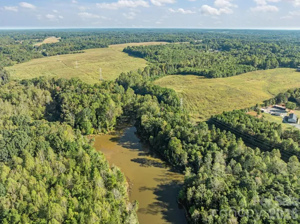a view of a lake with a big yard