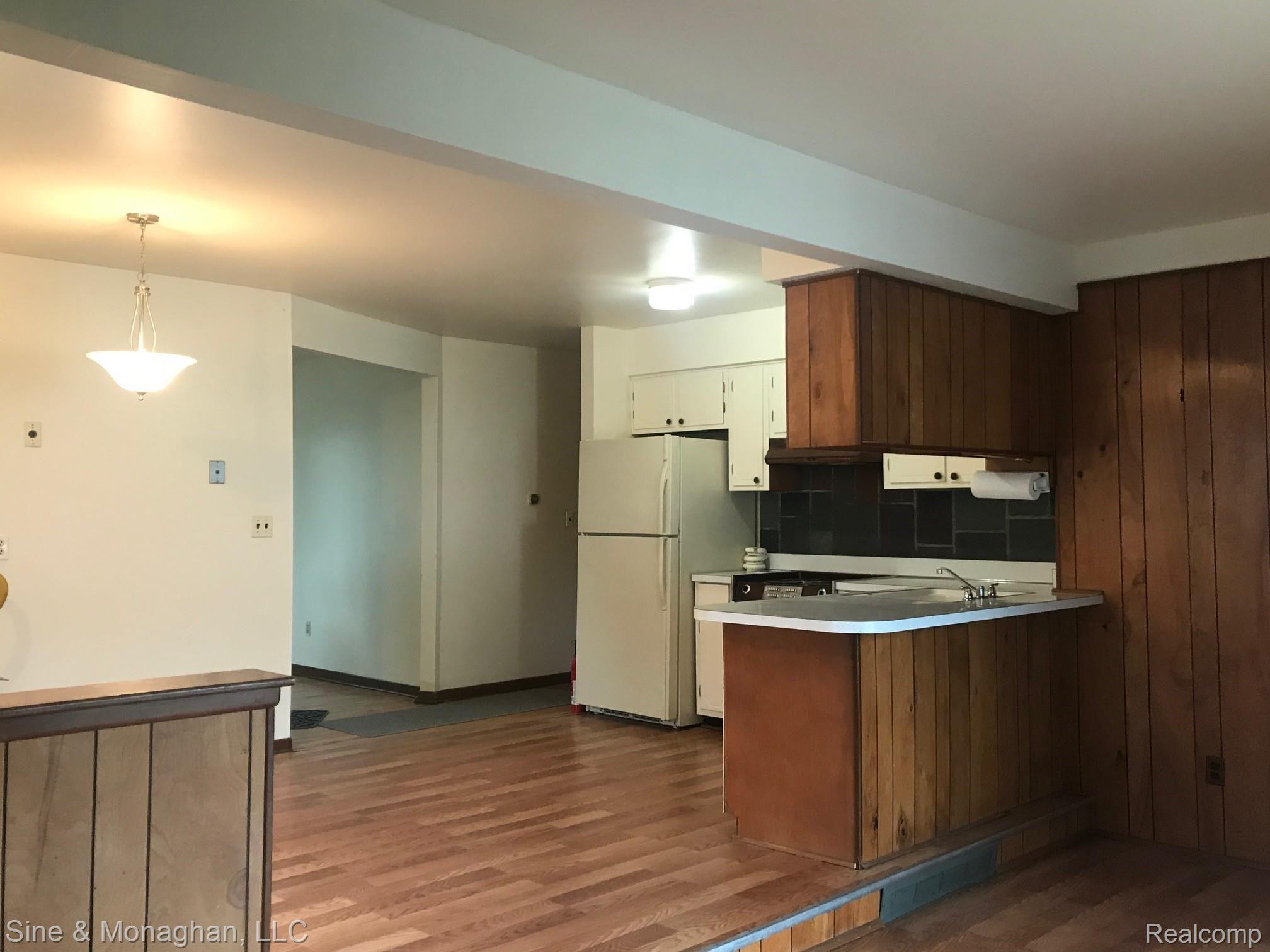 4638 Shell Court Warren, MI 48091 - Photo 10 of 28 4638 SHELL KITCHEN FROM NE TO LR AND HALLWAY TO BEDROOMS.jpg