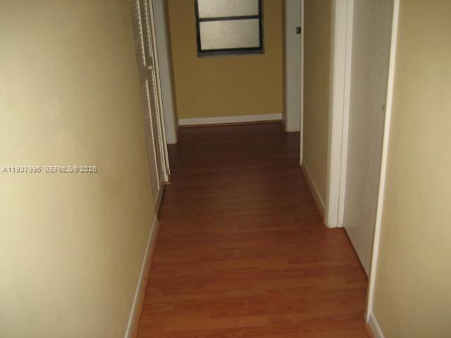 13224 Southwest 10th Terrace Miami, FL 33184 - Photo 19 of 32 a view of a hallway with wooden floor