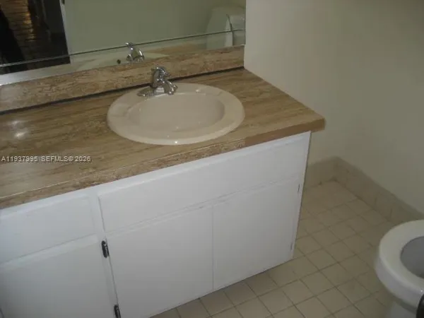 a bathroom with a sink and mirror