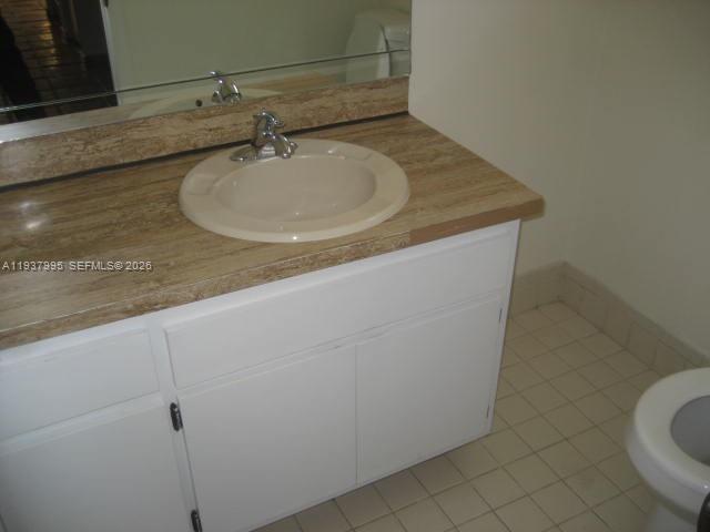 13224 Southwest 10th Terrace Miami, FL 33184 - Photo 23 of 32 a bathroom with a sink and a mirror