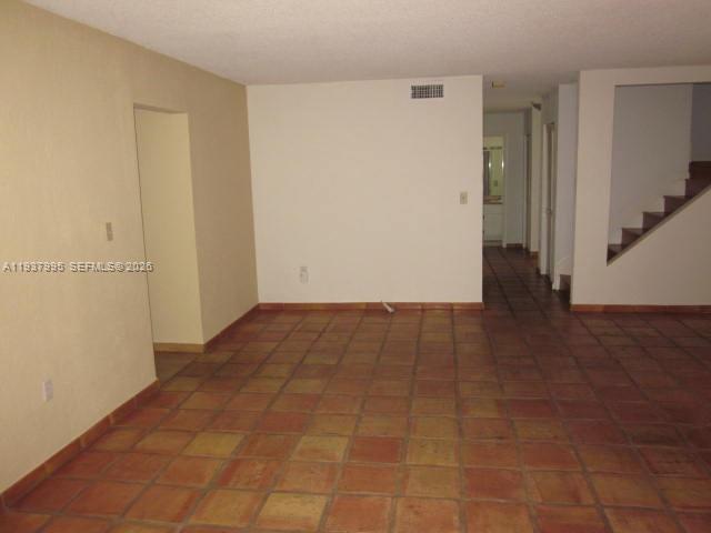 13224 Southwest 10th Terrace Miami, FL 33184 - Photo 25 of 32 an empty room with wooden floor and a window