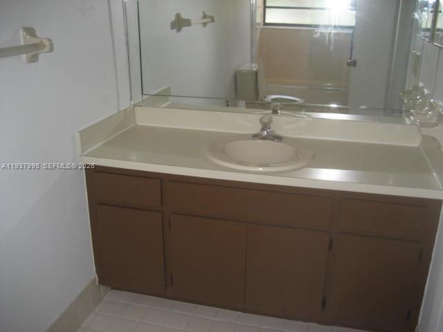 13224 Southwest 10th Terrace Miami, FL 33184 - Photo 26 of 32 a bathroom with a sink and mirror